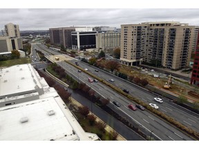 FILE- This Tuesday, Nov. 13, 2018, file photo shows a view of Crystal City, Va. On Tuesday, Nov. 13, Amazon said it will split its second headquarters between Long Island City in New York and Crystal City. Development along major highways in Northern Virginia and Washington have led to "unreasonable traffic delays on a daily basis" in the past few years, with drive times that used to take 40 minutes ballooning to up to 90 minutes, said Thomas Cooke, professor of business law at Georgetown University's McDonough School of Business.