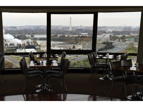 FILE- This Nov. 9, 2018, file photo shows a view of Washington from a revolving restaurant in Crystal City, Va. Some of the industries that have defined New York City and the Washington area will face increased competition for talent when Amazon sets up shop in their territory, with plans to hire 50,000 new workers amid the tightest job market in decades.