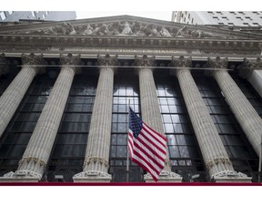FILE- In this Nov. 20, 2018, file photo an American flag flies outside New York Stock Exchange. The U.S. stock market opens at 9:30 a.m. EST on Wednesday, Nov. 28.