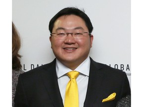 FILE - In this April 23, 2015 file photo, Jho Low, Director of the Jynwel Foundation, poses at the launch of the Global Daily website in Washington, D.C. The Justice Department on Thursday, Nov. 1, 2018,  charged the fugitive Malaysian financier in a money laundering and bribery scheme that pilfered billions of dollars from a Malaysian investment fund created to promote economic development projects in that country. The three-count indictment charges Low Taek Jho, who is also known as Jho Low, with misappropriating money from the state-owned fund and using it for bribes and kickbacks to foreign officials, to pay for luxury real estate, art and jewelry in the United States and to fund Hollywood movies, including "The Wolf of Wall Street."
