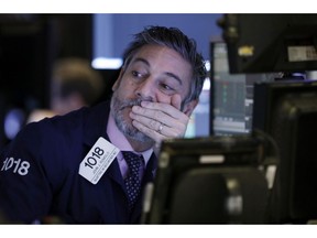 Trader John Romolo works on the floor of the New York Stock Exchange, Thursday, Nov. 29, 2018. U.S. stocks are lower Thursday morning after huge gains the day before.
