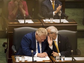 Ontario Premier Doug Ford and Finance Minister Victor Fedeli. The finance minister will unveil the government’s economic and fiscal outlook on Thursday.