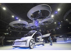Pop.Up Next, a prototype designed by Audi, Airbus and Italdesign is displayed at the Amsterdam Drone Week in Amsterdam, Netherlands, Tuesday, Nov. 27, 2018. The two-seater vehicle combines combines ground transportation with vertical take-off and landing capabilities.