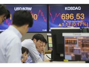 Currency traders watch monitors at the foreign exchange dealing room of the KEB Hana Bank headquarters in Seoul, South Korea, Tuesday, Nov. 27, 2018. Asian markets clocked more gains Tuesday ahead of a meeting between the U.S. and China at the Group of 20 summit this week, despite President Donald Trump's comments that it's "highly unlikely" he'll hold off on raising tariffs as Beijing requested.