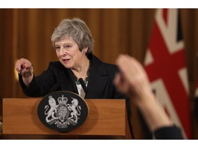 Britain's Prime Minister Theresa May takes questions during a press conference inside 10 Downing Street in London, Thursday, Nov. 15, 2018. British Prime Minister Theresa May says if politicians reject her Brexit deal, it will set the country on "a path of deep and grave uncertainty." Defiant in the face of mounting criticism, May said Thursday she believed "with every fiber of my being" that the deal her government struck with the European Union was the right one.