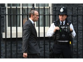 Britain's Secretary of State for Exiting the European Union Dominic Raab, leaves after a cabinet meeting at 10 Downing Street in London, Tuesday, Nov. 13, 2018. Negotiators from Britain and the European Union have struck a proposed divorce deal that will be presented to politicians on both sides for approval, officials in London and Brussels said Tuesday.