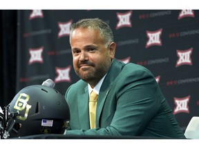 FILE - In this July 17, 2018, file photo, Baylor head coach Matt Rhule speaks during the NCAA college football Big 12 media days, in Frisco, Texas. At 43, Baylor coach Rhule is far removed from a playing career. That doesn't mean he won't run the gauntlet with his guys to prove a point. When Rhule was helping turn around the program at Temple, he already had many of his players outfitted with XTECH shoulder pads, a revolutionary protective device that is gaining traction on all levels of football. "I even wore the XTECH pads and went through bull-in-the-ring while I was at Temple," he recalls, "and I can tell you that the next day I felt less sore than I should have felt."