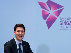 Prime Minister Justin Trudeau smiles as he delivers opening remarks at a bilateral meeting with Singapore Prime Minister Lee Hsien Loong in Singapore.