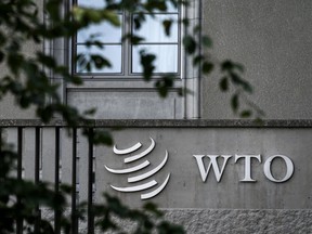 A sign for the World Trade Organization (WTO) is seen on their headquarters on September 21, 2018 in Geneva.