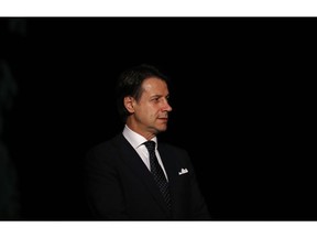 Italian Prime Minister Giuseppe Conte arrives for a Libya conference in Palermo, Italy, Monday, Nov. 12, 2018. Representatives of Libya's quarrelling factions and of countries keen on stabilizing the North African nation started meetings in Sicily Monday, as Italy encourages a political settlement that could bolster the fight against Islamic militants and stop illegal migrants from crossing the Mediterranean to Europe's southern shores.
