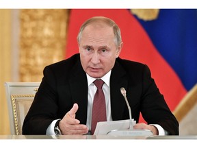Russian President Vladimir Putin speaks during a meeting in Moscow's Kremlin, Russia, Tuesday, Nov. 27, 2018. Putin and German Chancellor Angela Merkel spoke on the phone in the early hours on Tuesday, and the Russian president expressed a "serious concern" about what the martial law in Ukraine might entail. The Kremlin warned Tuesday that Ukraine's declaration of martial law over Russia's seizure of three Ukrainian ships might trigger a flare-up in hostilities in eastern Ukraine, while Kiev blamed Russia for parading captured Ukrainian seamen on television.