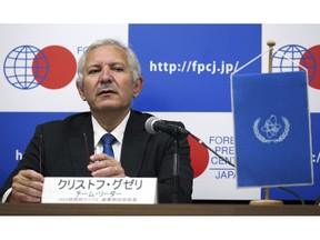 International Atomic Energy Agency (IAEA) team leader Christophe Xerri, Director of the IAEA's Division of Nuclear Fuel Cycle and Waste Technology, listens to a question during a press conference on a review Japan's decommissioning work at Fukushima Daiichi Site in Tokyo Tuesday, Nov. 13, 2018. Experts from the International Atomic Energy Agency have urged the operator of Japan's tsunami-wrecked Fukushima nuclear plant to urgently come up with a plan to dispose of massive amounts of radioactive water stored in tanks on the compound.