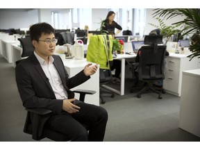 In this Oct. 31, 2018, photo, Huang Yongzhen, CEO of Watrix, speaks during an interview at his company's offices in Beijing. A Chinese technology startup hopes to begin selling software that recognizes people by their body shape and how they walk, enabling identification when faces are hidden from cameras. Already used by police on the streets of Beijing and Shanghai, "gait recognition" is part of a major push to develop artificial-intelligence and data-driven surveillance across China, raising concern about how far the technology will go.