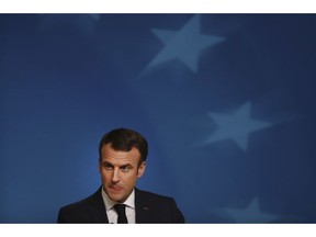 French President Emmanuel Macron speaks during a media conference during an EU summit in Brussels, Friday, Dec. 14, 2018. European Union leaders expressed deep doubts Friday that British Prime Minister Theresa May can live up to her side of their Brexit agreement and they vowed to step up preparations for a potentially-catastrophic no-deal scenario.