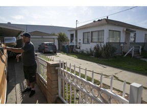 Candido Delgado, a next-door neighbor of a home where Elon Musk's Boring Company plans to build an elevator shaft below the property for the company's underground tunnel project, gets into his pickup truck Tuesday, Dec. 18, 2018, in Hawthorne, Calif.