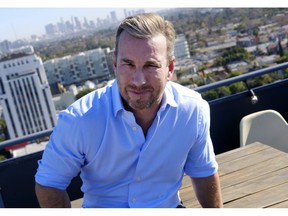 In this Wednesday, Dec. 19, 2018 photo attorney Brian Blatz sits on the roof deck at his office in Los Angeles. When California broadly legalized marijuana on Jan. 1, Blatz with a background in banking and health care had been working for a year to set up a trucking firm . On its website, Long Beach, California-based Verdant Distribution made clear its ambition: to be the nation's pre-eminent business for transporting cannabis. But the choppy rollout of California's legal market saddled the company with costly delays, and it was undone in the end by an abrupt state rule change that allowed just about any marijuana business to become its own distributor, undercutting the need for stand-alone companies like Verdant to do the job.