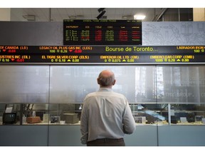 Canada's main stock market is expected to recover in 2019 from its worst performance in a decade that saw the exchange lose 15 per cent amid extreme volatility, plunging oil prices and geopolitical uncertainty, say markets experts. A man watches the financial numbers at the TMX Group in Toronto's financial district on May 9, 2014.