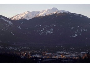 The village of Whistler, B.C. is seen as the sun sets on the snow capped mountains Friday, Feb. 3, 2012. The resort town of Whistler is learning the hard way that getting involved in the emotionally charged fight between environmentalists and oil companies can result in negative consequences.
