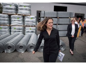 Minister of Foreign Affairs Chrystia Freeland, front, leaves a news conference after touring Tree Island Steel, in Richmond, B.C., on Friday, Aug. 24, 2018. Ultimately, Canada's foreign minister led the country's efforts to salvage a new North American free trade deal. That white-knuckle ride in 2018 has earned Freeland the title of Canada's business news maker of the year. She was the runaway choice of 81 per cent of editors surveyed by