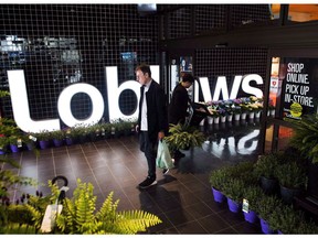 A man leaves a Loblaws store in Toronto on Thursday, May 3, 2018. Canadian grocers doubled down on transforming themselves into destinations for time-strapped shoppers this year, ramping up delivery options, acquiring meal kit companies and adding in-store eateries. Shifting consumer demands and tech titan Amazon's recent acquisition of Whole Foods Market are pressuring grocers to evolve, yet experts say it's only the beginning of a transformation in how Canadians shop for food.THE CANADIAN PRESS/Nathan Denette