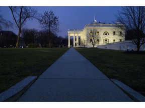 The White House is seen, Friday, Dec. 28, 2018, in Washington. The partial government shutdown will almost certainly be handed off to a divided government to solve in the new year, as both parties traded blame Friday and President Donald Trump sought to raise the stakes in the weeklong impasse.