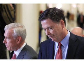 Former FBI Director James Comey, right, with his attorney, David Kelley, leaves Capitol Hill in Washington, Monday, Dec. 17, 2018, after a second closed-door interview with two Republican-led committees investigating what they say was bias at the Justice Department before the 2016 presidential election.