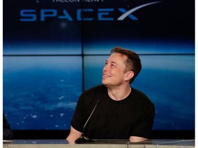 FILE - In this Feb. 6, 2018, file photo, Elon Musk, founder, CEO, and lead designer of SpaceX, speaks at a news conference from the Kennedy Space Center in Cape Canaveral, Fla. Musk is set to unveil an underground transportation tunnel that could move people faster than subways. Musk plans to unveil the test tunnel Tuesday, Dec. 18, 2018, as well as the autonomous cars that will carry people through it. He's also set to show off elevators he says will bring users' own cars from the surface to the tunnel.