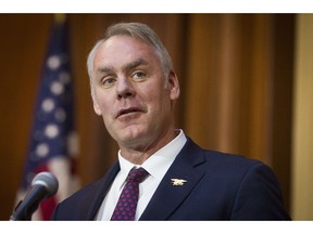 FILE - In this Dec. 11, 2018 file photo, Secretary of the Interior Ryan Zinke speaks after an order withdrawing federal protections for countless waterways and wetland was signed, at EPA headquarters in Washington.  Trump says on Saturday, Dec. 15,  Zinke leaving administration at end of year, successor to be announced next week.