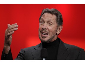 FILE - In this Oct. 2, 2012 file photo, Oracle CEO Larry Ellison gestures while giving a keynote address at Oracle OpenWorld in San Francisco. Tesla is naming Ellison and an executive from Walgreens to its board as part of a settlement with U.S. regulators who demanded more oversight of CEO Elon Musk. The company said Friday, Dec. 28, 2018, that Ellison and Kathleen Wilson-Thompson are the new independent directors, effective immediately.