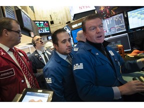 Stock traders work at the New York Stock Exchange, Wednesday, Dec. 19, 2018.