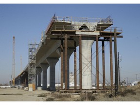 FILE - This Wednesday, Dec. 6, 2017, file photo, shows one of the elevated sections of the high-speed rail under construction in Fresno, Calif. Gov. Jerry Brown has championed the bullet train and giant twin tunnels to reroute the states water supply, two major infrastructure projects that are mired in lawsuits and critics charge will never be built. Brown leaves office Jan. 7, 2019, after a record four terms in office, from 1975-1983 and again since 2011.