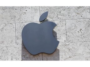 FILE - In this Aug. 8, 2017, file photo, the Apple logo is shown at a store in Miami Beach, Fla. Apple released a statement early Thursday, Dec. 13, 2018, saying it plans to build a $1 billion campus in Austin, Texas. The company's statement says its plans also include establishing locations in Seattle, San Diego and Culver City, California, with more than 1,000 employees at each.