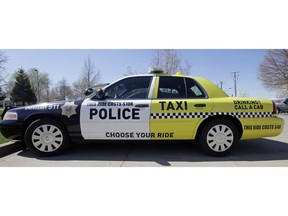 FILE - This March 24, 2017, file photo shows a Woods Cross police vehicle sitting in their parking lot in Woods Cross, Utah. The United States' lowest DUI threshold takes effect this weekend in Utah. Lawmakers in the state approved the 0.05 percent blood-alcohol limit in 2017, and Gov. Gary Herbert signed it into law. The change goes into effect Saturday, Dec. 29, 2018.