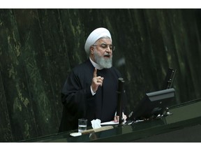 Iranian President Hassan Rouhani speaks as he submits next year's budget bill to parliament in Tehran, Iran, Tuesday, Dec. 25, 2018. The $47.5 billion budget is less than half of last year's, mainly due to the severe depreciation of the local currency following President Donald Trump's decision to withdraw from the 2015 nuclear deal and restore U.S. sanctions.