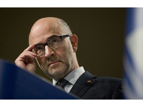 European Commissioner for Economic and Financial Affairs Pierre Moscovici pauses before speaking during a media conference at EU headquarters in Brussels, Wednesday, Dec. 19, 2018. The European Commission says it has reached an agreement with Italy to avert action over the country's budget plans, which the EU's executive arm had warned could break euro currency rules.