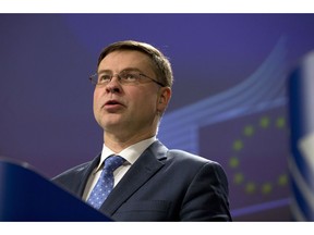 European Commissioner for Euro and Social Dialogue Valdis Dombrovkis speaks during a media conference at EU headquarters in Brussels, Wednesday, Dec. 19, 2018. The European Commission says it has reached an agreement with Italy to avert action over the country's budget plans, which the EU's executive arm had warned could break euro currency rules.