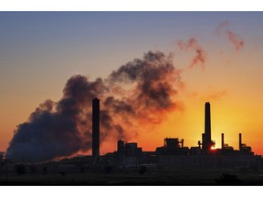 FILE - In this July 27, 2018, file photo, the Dave Johnson coal-fired power plant is silhouetted against the morning sun in Glenrock, Wyo. The Trump administration on Friday targeted an Obama-era regulation credited with helping dramatically reduce toxic mercury pollution from coal-fired power plants, saying the benefits to human health and the environment may not be worth the cost of the regulation. The 2011 Obama administration rule, called the Mercury and Air Toxics Standards, led to what electric utilities say was an $18 billion clean-up of mercury and other toxins from the smokestacks of coal-fired power plants.