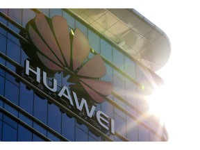 The logo of Huawei stands on its office building at the research and development centre in Dongguan in south China's Guangdong province, Tuesday, Dec. 18, 2018. While a top executive of Chinese tech giant Huawei faces possible U.S. charges over trade with Iran, the company's goal to be a leader in next-generation telecoms is colliding with security worries abroad. Australia and New Zealand have barred Huawei as a supplier for fifth-generation networks, joining the U.S. and Taiwan. Last week, Japan's cybersecurity agency said Huawei and other vendors deemed risky will be off-limits for government purchases.
