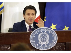 Italian premier Giuseppe Conte gestures during a year end press conference in Rome, Italy, Friday, Dec.28, 2018.
