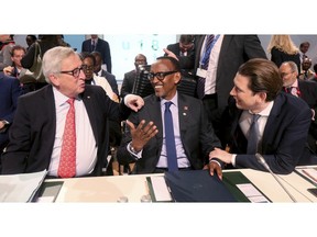 European Commission President Jean-Claude Juncker talks with Rwanda's President Paul Kagame and Austrian Chancellor Sebastian Kurz, from left, at the start of the EU Africa Forum in Vienna, Austria, Tuesday, Dec. 18, 2018.