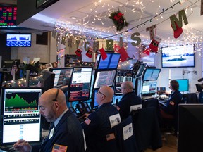 Traders at the NYSE saw the Nasdaq Composite Index sink 2.2% to 6,635.48. Major indices had been up about one percent prior to the Fed rate hike announcement.