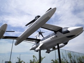 A scaled model of Uber Technologies Inc.'s eCRM-003, an electric vertical take-off and landing jet, is displayed during the Uber Elevated Asia Pacific Expo event in Tokyo, Japan, this summer.