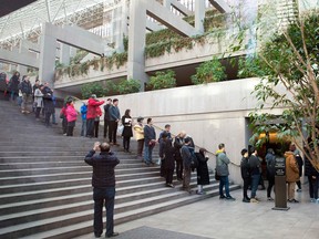 People line up outside the bail hearing of Huawei Technologies Chief Financial Officer Meng Wanzhou at British Columbia Superior Courts  on Dec. 10, 2018.