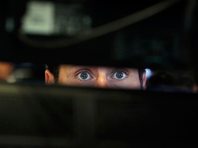 Specialist Michael Pistillo watches the bond yield screens at the New York Stock Exchange. One of the most reliable warning signals has preceded every one of the U.S. economy’s recessions for more than half a century.