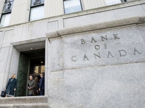 Carolyn Wilkins, senior deputy governor of the Bank of Canada, left, and Stephen Poloz, governor of the Bank of Canada, leave the Bank of Canada building.