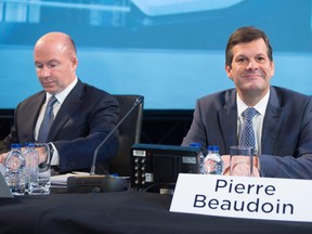 Bombardier's chief executive Alain Bellemare, left, and chairman Pierre Beaudoin attend an annual meeting in Montreal.