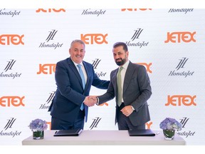 Adel Mardini of Jetex signs with Simon Roads of Honda Aircraft Company