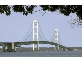 FILE - This July 19, 2002, file photo, shows the Mackinac Bridge that spans the Straits of Mackinac from Mackinaw City, Mich. The Michigan Legislature approved a bill Tuesday, Dec. 11, 2018,  that would allow the replacement of a 65-year-old oil pipeline in a key Great Lakes waterway, voting to create a state authority that would oversee the construction of a tunnel to encase a new segment of pipe.