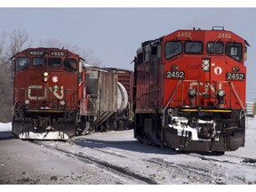Canadian National locomotives are seen Monday, February 23, 2015 in Montreal. Canadian National Railway is bidding to acquire a stake in the largest container terminal in Eastern Canada.