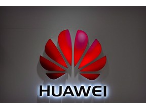 In this July 4, 2018, file photo, the Huawei logo is seen at a Huawei store at a shopping mall in Beijing. If trade ties between China and the United States had a Facebook page, this week's relationship status would surely read, "It's complicated."